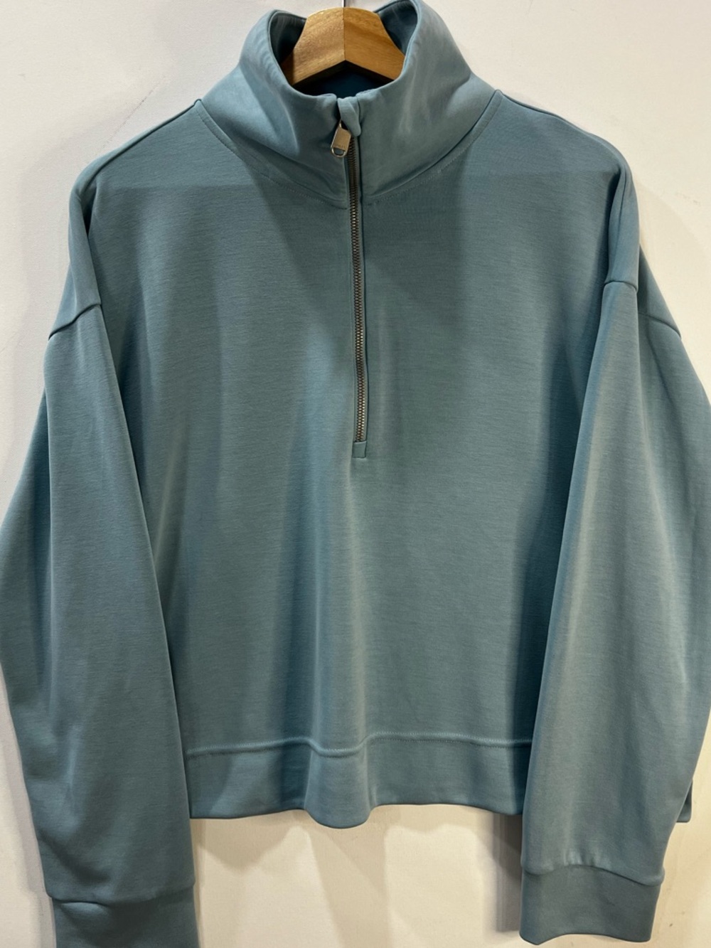 Athleta Half-Zip Mock Neck Pullover in Lt BlueTeal. Color photographs darker.